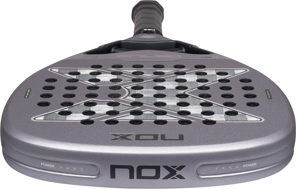 Grey teardrop-shaped NOX AT10 Genius Attack 18K Alum By Agustín Tapia 2027 padel racket with a checkered pattern, perforated surface, and black handle.