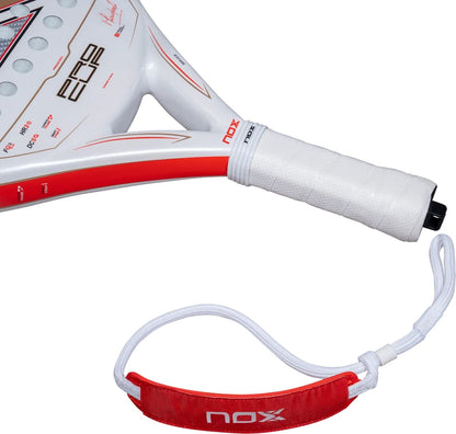 White NOX ML10 Pro Cup Coorp By Miguel Lamperti 2027 padel racket with red accents and a white grip featuring a red and white wrist strap.