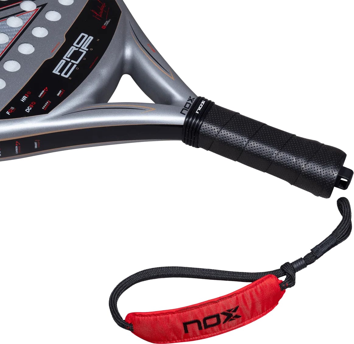Close-up of a silver and black NOX ML10 Pro Cup Rough Surface By Miguel Lamperti 2027 padel racket with a perforated black grip and a red wrist strap.