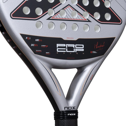 Close-up of a silver NOX ML10 Pro Cup Rough Surface By Miguel Lamperti 2027 padel racket, showing the perforated face, black center branding, signature, and throat.