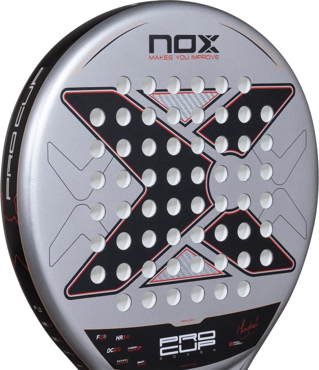 Round NOX ML10 Pro Cup Rough Surface By Miguel Lamperti 2027 padel racket with a silver face, a large black X pattern featuring circular holes, and a red border.