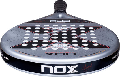 NOX ML10 Pro Cup Rough Surface By Miguel Lamperti 2027 padel racket featuring a silver face, a large black X graphic, and a perforated, rough surface.