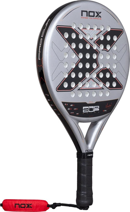 Silver and black round NOX ML10 Pro Cup Rough Surface By Miguel Lamperti 2027 Padel Racket with a large X-shaped pattern across the rough surface, shown with a matching red wrist strap.