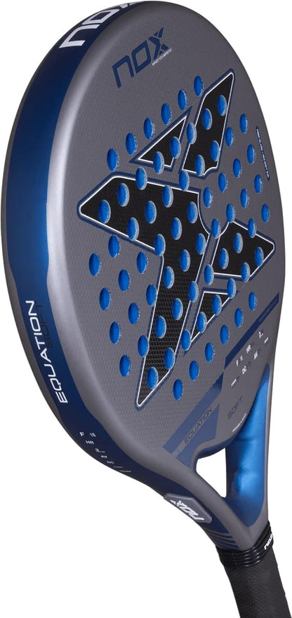 NOX Equation Soft Advanced 2027 padel racket with a grey and blue gradient surface, featuring a large X-shaped cutout pattern and a black handle.