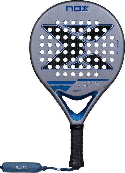 NOX Equation Soft Advanced 2027 padel racket with a grey face, a large black X pattern of holes, and a blue handle with a matching wrist strap.