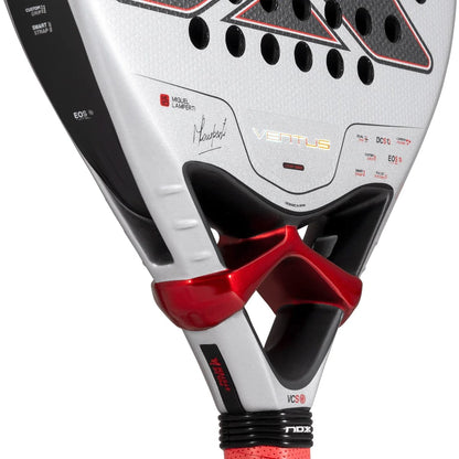 Close-up of a silver NOX Ventus Control 3K By Miguel Lamperti 2027 Padel Racket with a black and red frame, featuring a signature and technical markings on the face.