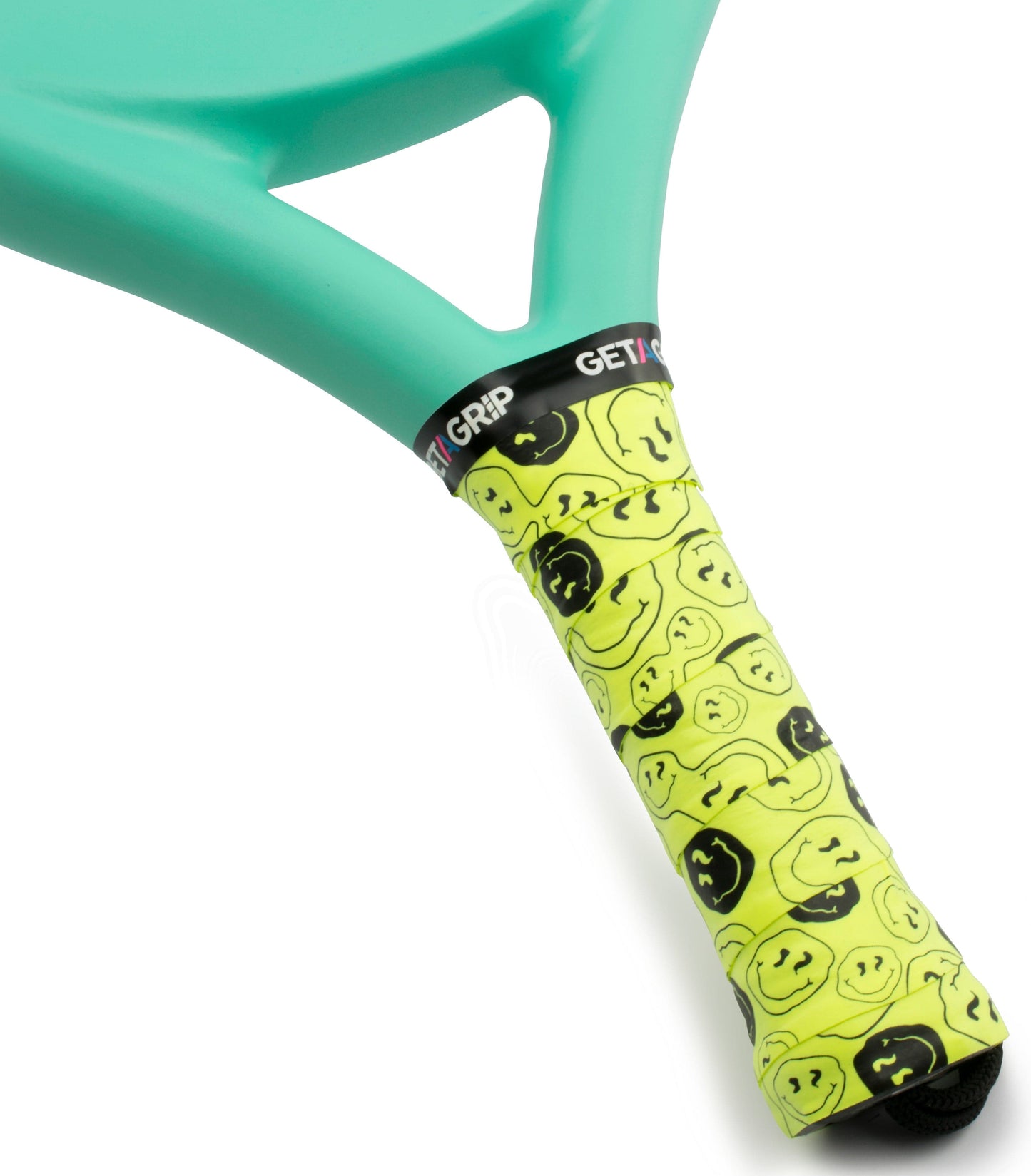 Close-up of a tennis racket handle wrapped in the Get a Grip Padel Overgrip - Smiley by Get A Grip, featuring bright yellow color, smiley faces pattern, and part of the brand name on the vibrant grip. Teal racket frame is also visible.