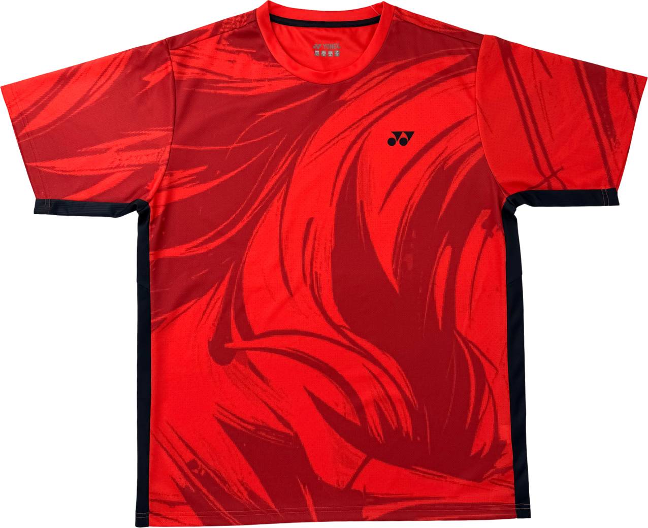The Yonex YTM14 Men’s Padel T-Shirt in Coral features bold black abstract swirl patterns, short sleeves, and a discreet black logo on the left chest. Black panels accentuate the sides of the shirt, combining athletic style with performance. Perfect for those seeking modern and stylish padel apparel, this Yonex t-shirt is designed to meet all the demands of today’s active men.