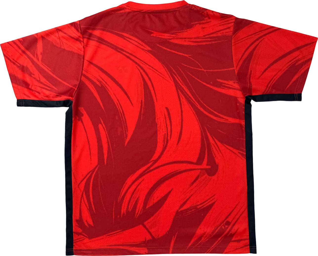 The Yonex YTM14 Mens Padel T-Shirt in Coral is a short-sleeve sports shirt for men, featuring abstract dark red wave patterns and black trim along the sides and sleeve edges—perfect as a Yonex padel t-shirt or versatile padel apparel.