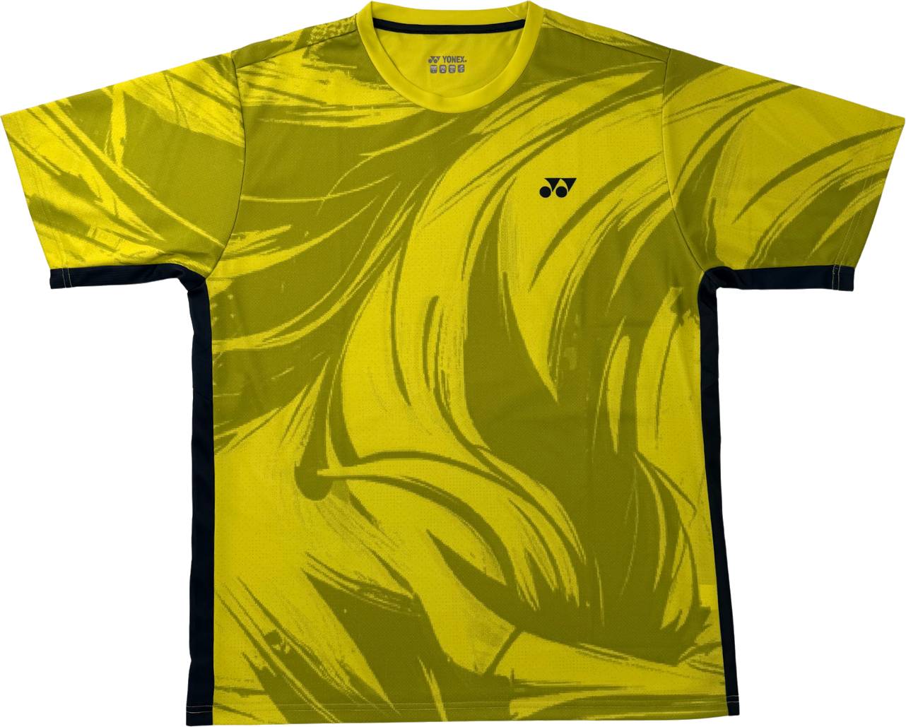 The Yonex YTM14 Mens Padel T-Shirt in lime features black abstract brushstroke patterns, contrasting black side panels, and a small black Yonex logo on the left chest—combining style and performance for the court.