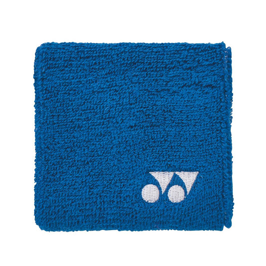 The Yonex AC493 Padel Wristband in blue showcases a white logo comprised of two geometric shapes on one side, making it ideal for on-court use.