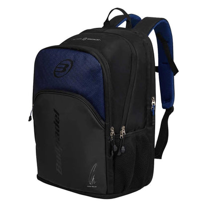 The Bullpadel BPM26008 Vertex Padel Backpack - Geo Blue features multiple zippered compartments, side mesh pockets, padded shoulder straps, the Bullpadel logo, and a Bea González-inspired graphic on the front.