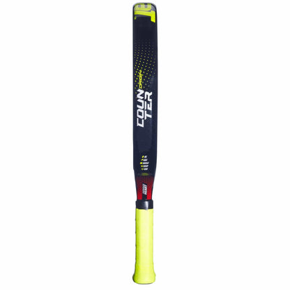 A modern cricket bat inspired by the Babolat Counter Origin Padel Racket—black face with yellow and red accents, "COUNTER" branding, and a bright yellow grip tape on the handle for superior control.