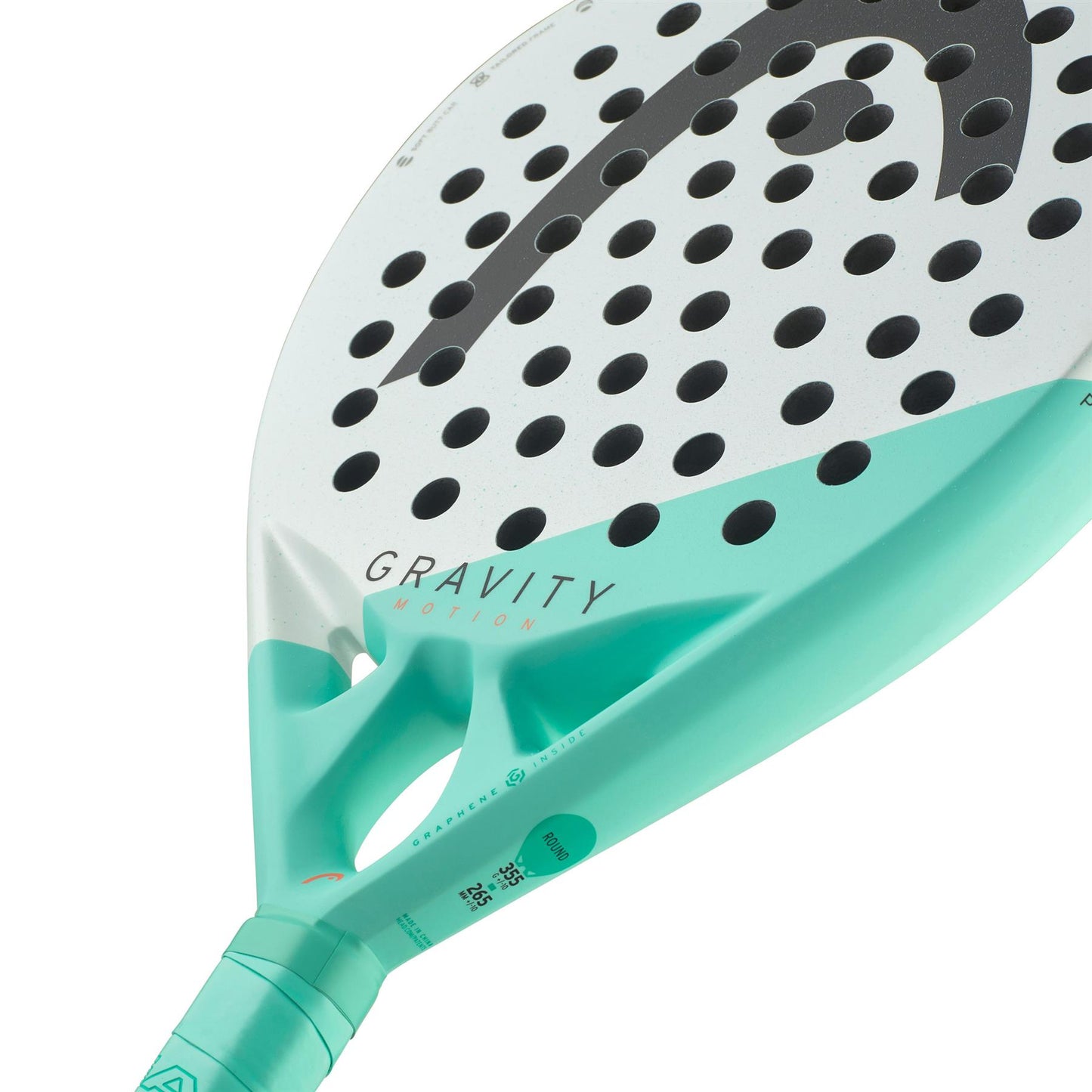 Close-up of a mint-colored and white paddle racket with black polka dots, branded "HEAD Gravity Motion 2024," prominently displayed. Equipped with Spin Surface technology, the handle is partially visible at the bottom.