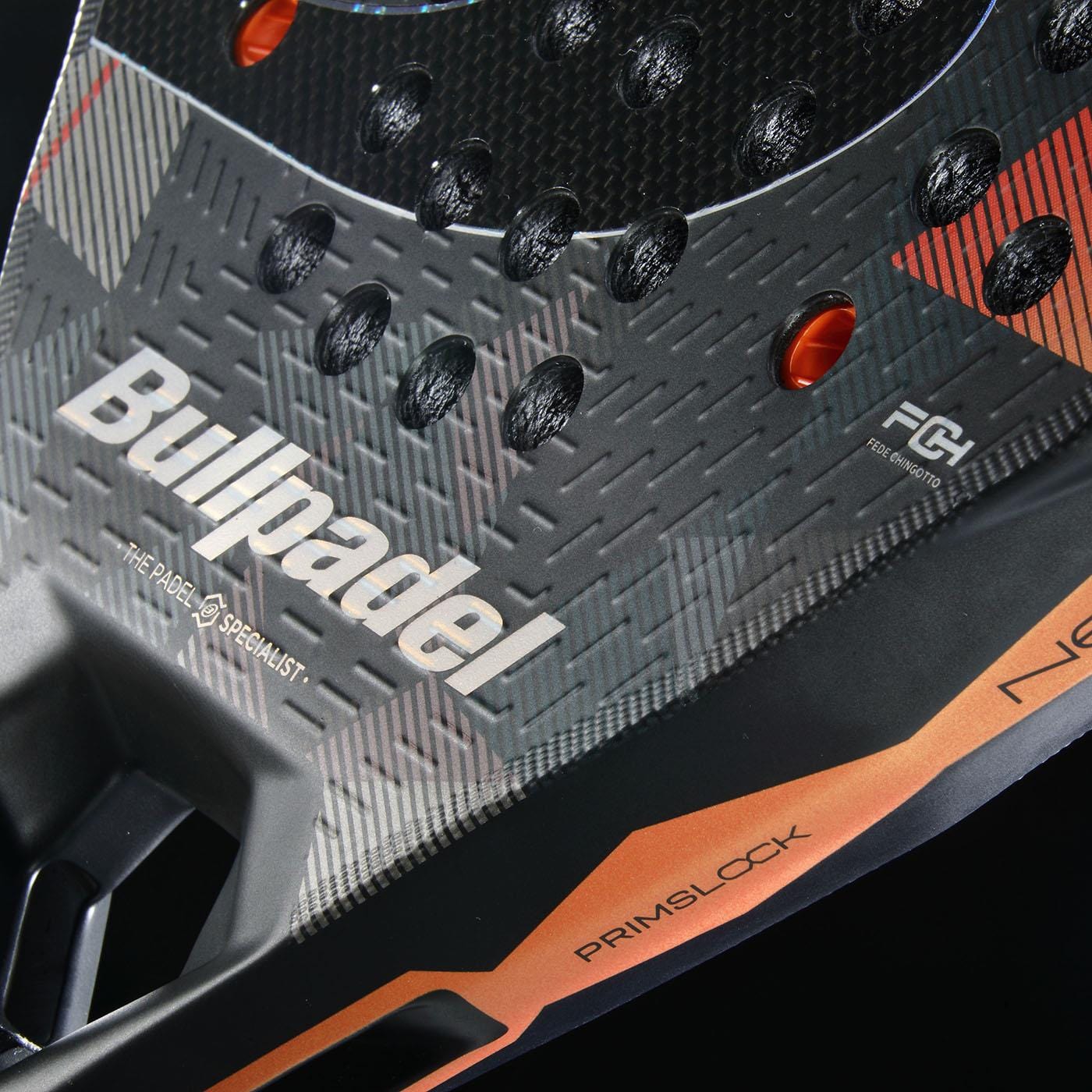 Close-up of the Bullpadel Neuron 02 Edge 2026 padel racket in black/red, featuring a textured surface, PrimBlock label, visible carbon fiber pattern, and PrismLock technology branding.