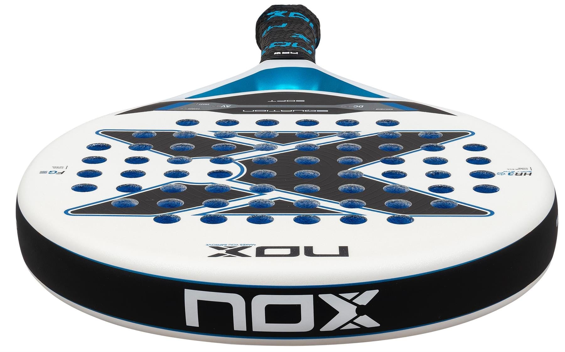 A close-up of the NOX Equation Soft Advanced 2026 Padel Racket highlights its round head with blue and black accents, multiple holes, anti-vibration system, and the "NOX" brand name featured prominently on the frame.