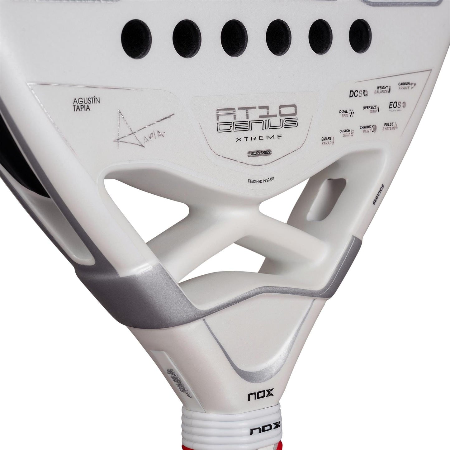 Close-up of the NOX AT10 Genius Attack 12K Alum Extrem By Agustín Tapia 2026 Padel Racket in white with black accents, featuring Agustín Tapia's signature and designed for powerful play.