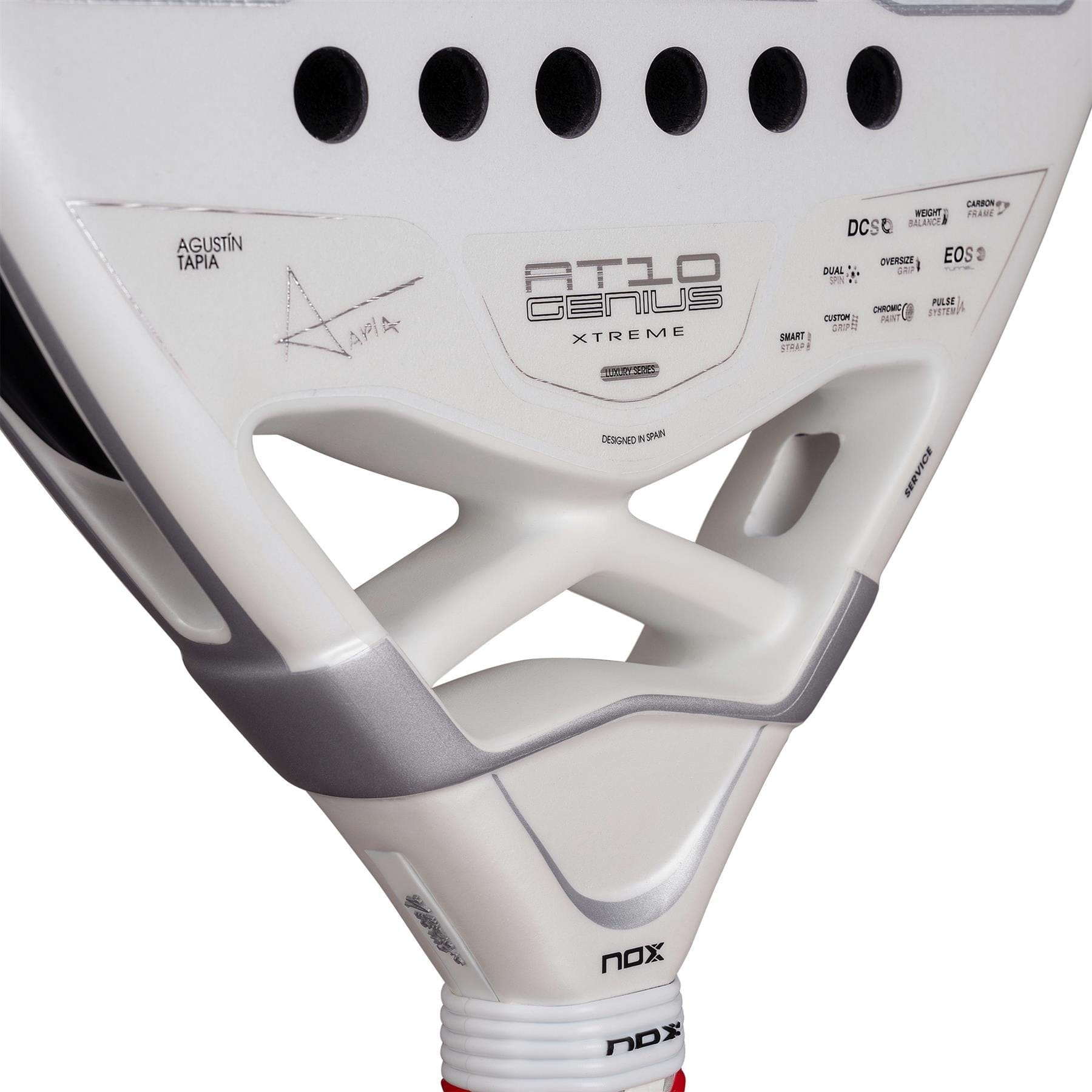 Close-up of the NOX AT10 Genius Attack 12K Alum Extrem By Agustín Tapia 2026 Padel Racket in white with black accents, featuring Agustín Tapia's signature and designed for powerful play.