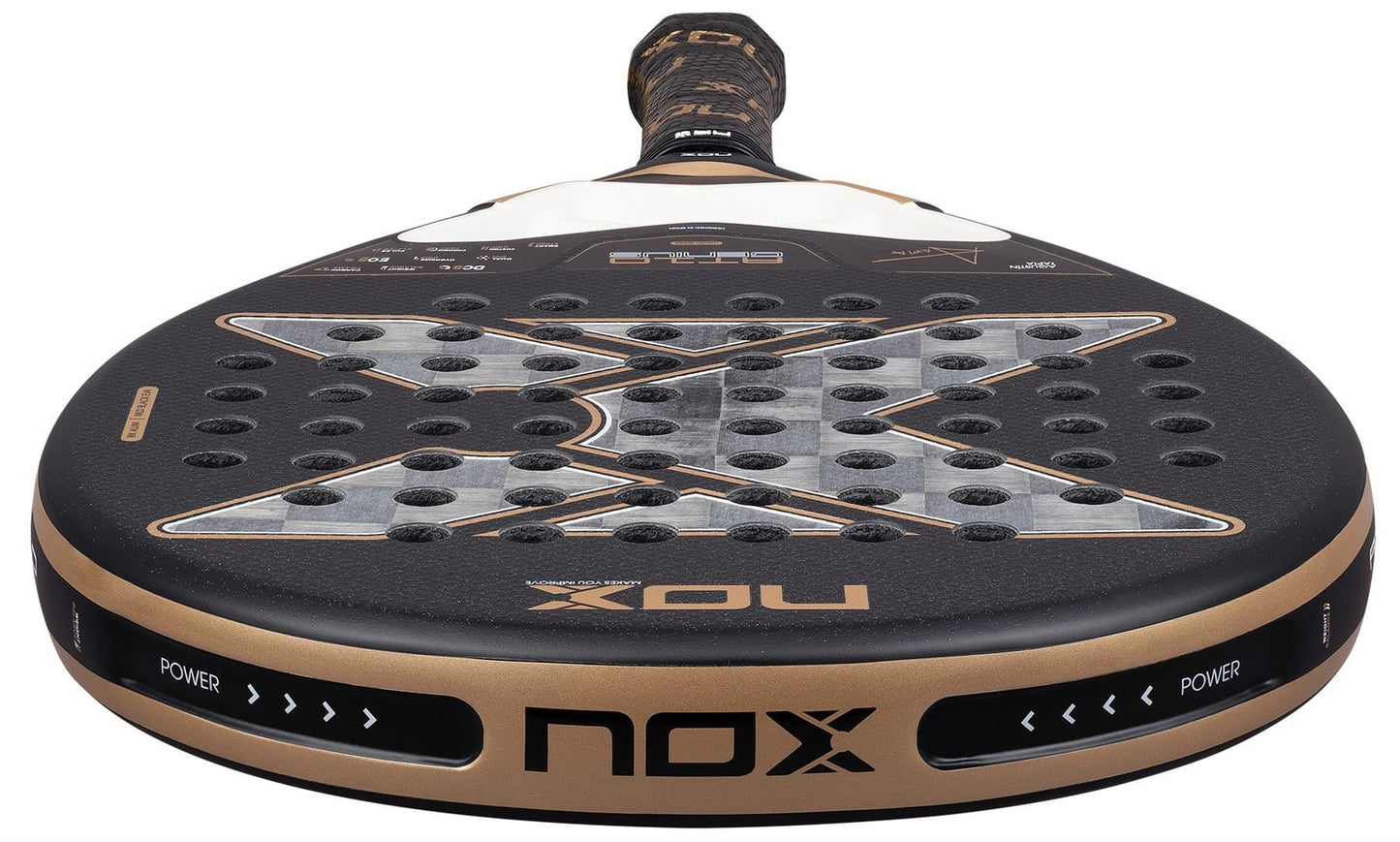 Close-up of the NOX AT10 Genius 18K Alum By Agustín Tapia 2026 Padel Racket in black and gold by NOX, featuring a Dual Spin surface, large "X" design, multiple holes, and "POWER" printed on the edge near the handle.