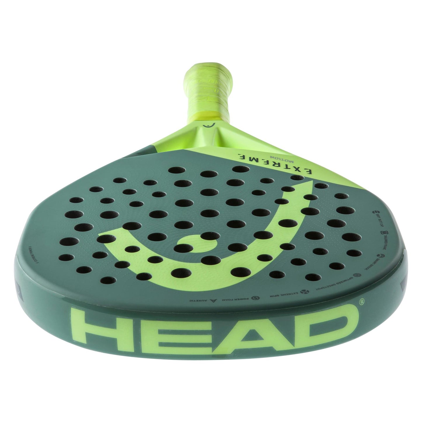 Introducing the HEAD Extreme Motion 2023 Padel Racket in green, featuring "HEAD" prominently along the edge and "EXTREME" across its surface. Equipped with Auxetic technology and Power Foam, this padel racket displays a large logo and has a perforated design to enhance your gameplay.