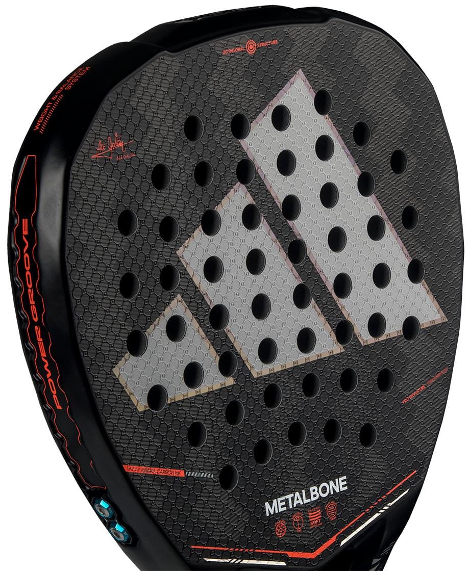 Close-up of the black ADIDAS Metalbone by Ale Galán 2026 Padel Racket featuring a honeycomb texture, large white adidas logo, round holes, red accents, "METALBONE" near the bottom, and an adjustable weight system.