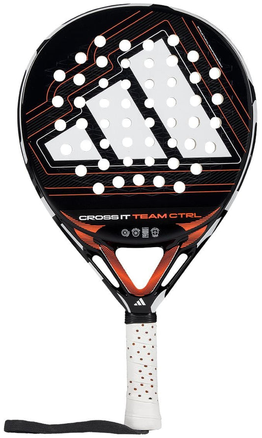 The ADIDAS Cross It Team Ctrl 2026 Padel Racket by adidas features a black and orange design, large logo, multiple round holes, a white grip with Extra Power Grip, black wrist strap, and "Cross It Team CTRL" printed on the front.