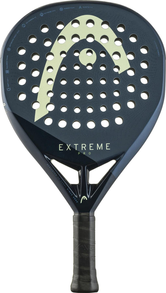 The HEAD Extreme Pro 2025 Padel Racket - Blue has a black and dark blue perforated round face, Extreme Spin technology, a yellow curved design, and a black textured grip.