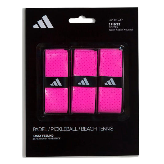 A black pack with white adidas branding contains three bright pink ADIDAS Padel Overgrips (3 Pack) - Pink, each with small perforations for comfort and performance in padel, pickleball, and beach tennis.