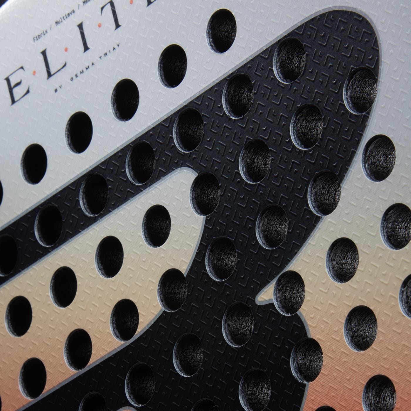 Close-up of the perforated, textured grip with round holes and partial "ELITE" branding on the Bullpadel Elite W 2026 Padel Racket - Black / White, highlighting its lightweight feel and high performance for women.