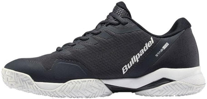 The Bullpadel Icon 26V Men's Padel Shoes in navy feature a white sole, textured grip outsole, and Bullpadel logo with "Icon 26V" on the side—lightweight and ideal for padel enthusiasts.