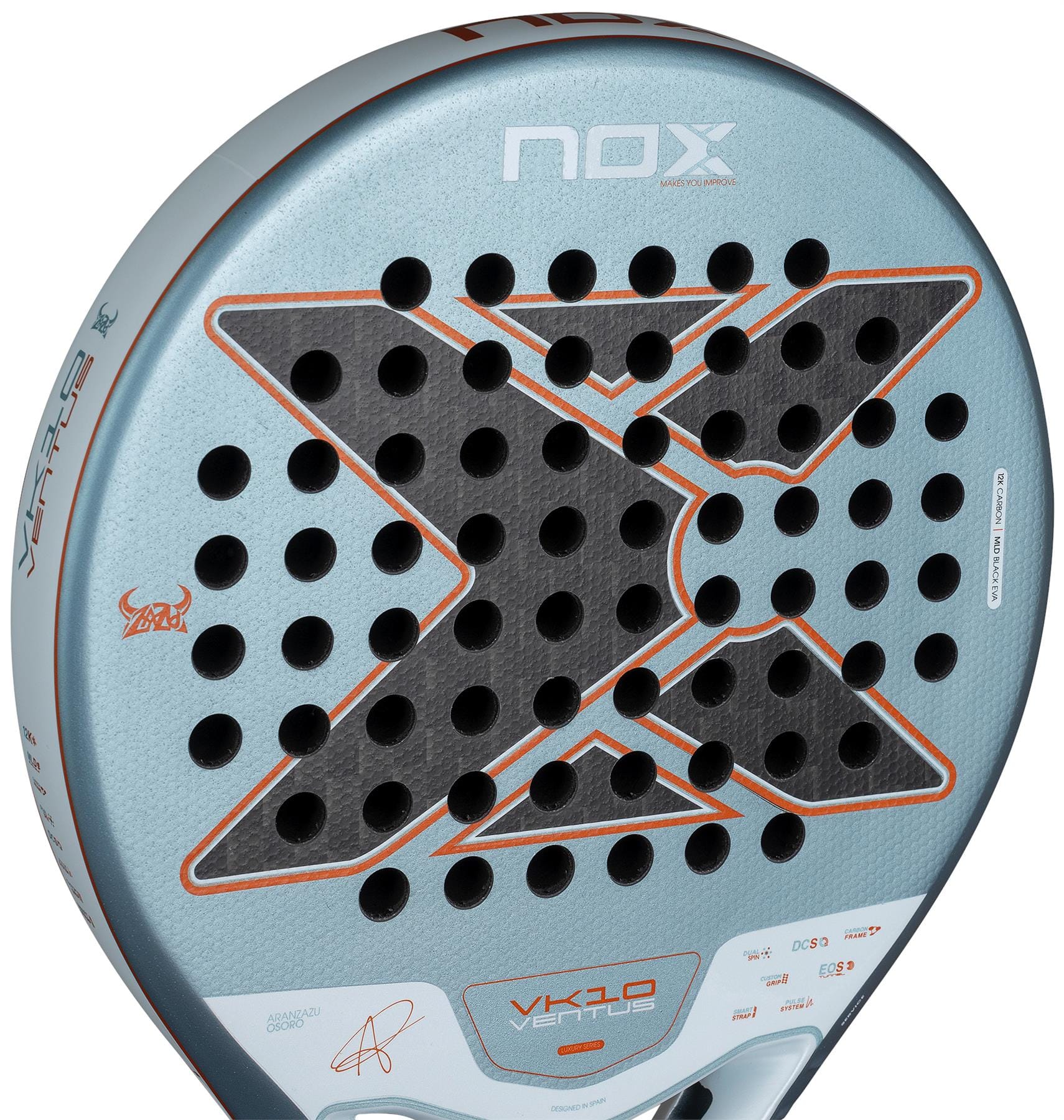 Close-up of the NOX Luxury VK10 Ventus Control 12K By Aranzazu Osoro 2026 Padel Racket, a light blue and gray padel racket with black holes in an X pattern, orange accents, 12K Carbon build, NOX branding, and player signatures.