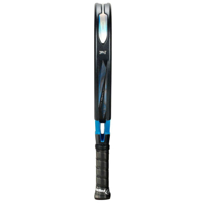 The Bullpadel Vertex 05 Comfort 2026 Padel Racket—Black/Blue—is shown vertically from the side, featuring a thin profile, black grip, blue frame accents, and durable Fibrix fibre construction by Bullpadel.