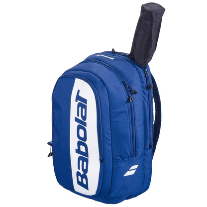 The Babolat Court Hero Padel Backpack in dark blue features the white logo, zippered compartments, and a racket handle slot. Made with recycled PET, it’s ideal for carrying your padel or tennis gear in style.