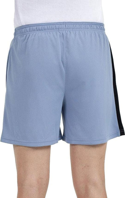 A person is shown from the back wearing Bullpadel Campaza Mens Padel Shorts in Shadow Blue, featuring an elastic waistband, black side stripe, and Quickerdry technology for comfort, paired with a white shirt.