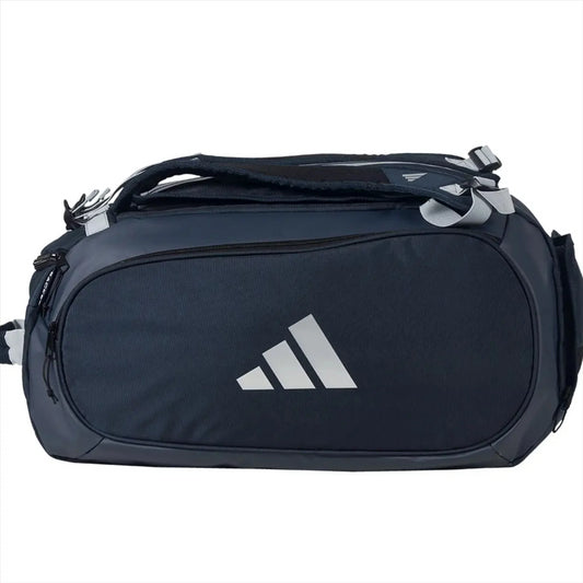 The ADIDAS Tour 3.4 Padel Racket Bag by adidas is a blue sports bag with multiple zippers and a top handle, ideal for padel rackets or equipment, and is shown against a plain white background.