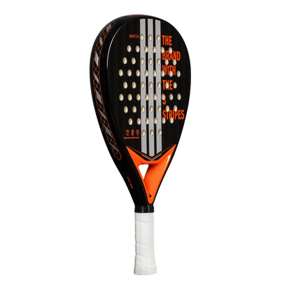 The ADIDAS Match Black 3.4 Padel Racket features a sleek black design with bold orange graphics, including vertical stripes and "THE BRAND WITH THE STRIPES" text. Its hybrid head shape and EVA Soft Performance foam enhance play, while the handle is wrapped in white grip tape.