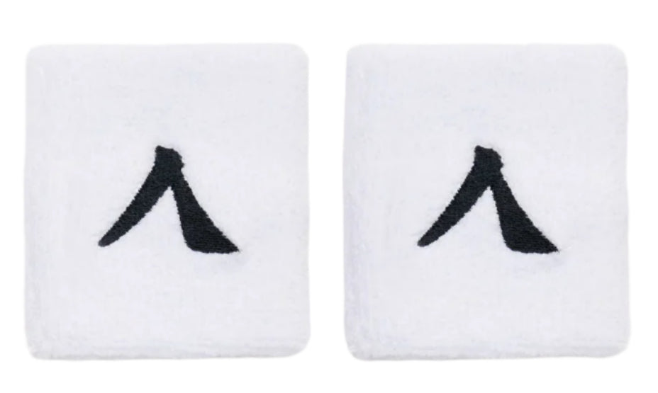 The Kanso 7cm Wristband - 2 Pack - White offers maximum comfort with absorbent fabric and a minimalist design, featuring a black angular check mark pattern on a plain white surface.