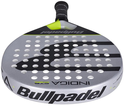 The Bullpadel Indiga Ctr 2026 Padel Racket features a silver and black design with the Bullpadel logo on the face, multiple small holes for precision control, and a black grip handle.