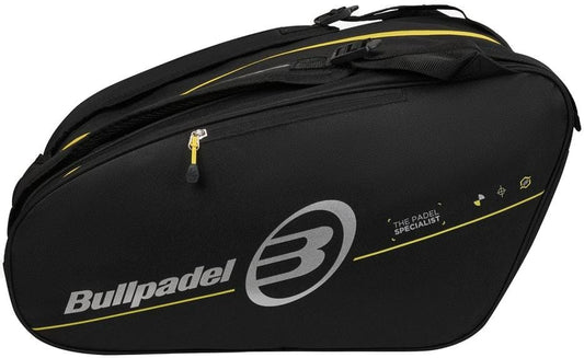 The Bullpadel BPP26015 Tour 2026 Padel Racket Bag in black features yellow accents, a large "B" logo, "THE PADEL SPECIALIST" text, multiple zippered compartments, shoulder strap, and thermal racket sections.