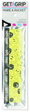 The Get a Grip Padel Overgrip - Smiley by Get A Grip features a retro bright yellow design with black smiley faces and a black band showcasing the white and pink Get A Grip logo, perfect for adding style to your racket.