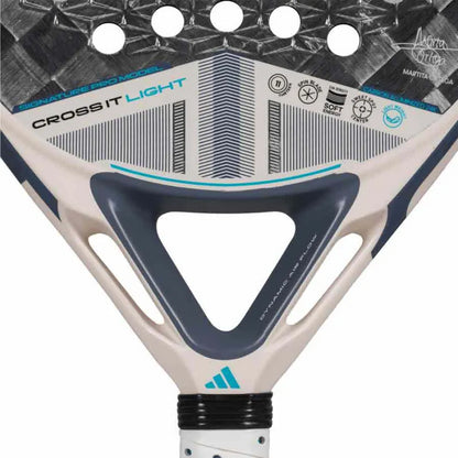 Close-up of the adidas Cross It Light 3.4 Padel Racket - Chalk White featuring "CROSS IT LIGHT" labeling, bold blue, grey, and white geometric designs, plus icons showing Dynamic Air Flow and Power Extra Grip features on top.