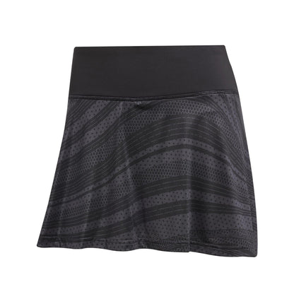 The ADIDAS Women's Club Graphic Padel Skirt in black is crafted from recycled materials, featuring a wide waistband, subtle stripes and dots, and Climacool technology for comfort, ideal for sports or casual wear.