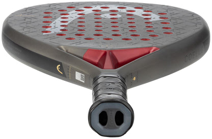 A close-up of the HEAD Coello Pro 2026 Padel Racket highlights its black grip, perforated carbon hybrid hitting surface with red accents, the HEAD logo, and a QR code on the side.