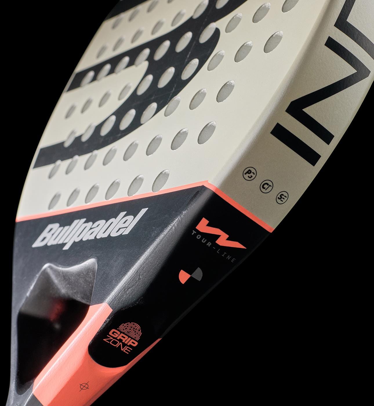 Close-up of the Bullpadel Indiga W 2026 Padel Racket by Bullpadel, highlighting its textured hitting surface and distinctive branding, designed for lightweight performance against a sleek black backdrop.