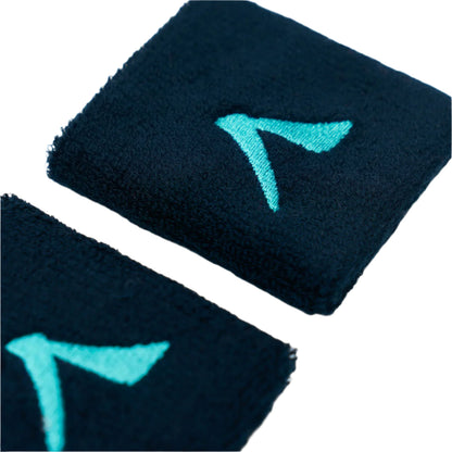 Close-up of two Kanso 7cm Wristbands in navy, featuring teal logos resembling a stylized "A" or arrow embroidered on absorbent fabric for maximum comfort, positioned diagonally against a white background.