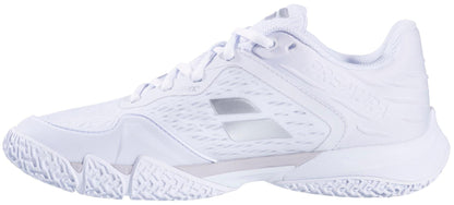 The Babolat Premura 3 Women's Padel Shoe in white and silver features a textured sole, mesh upper, lace-up closure, and subtle gray accents, shown from the side.