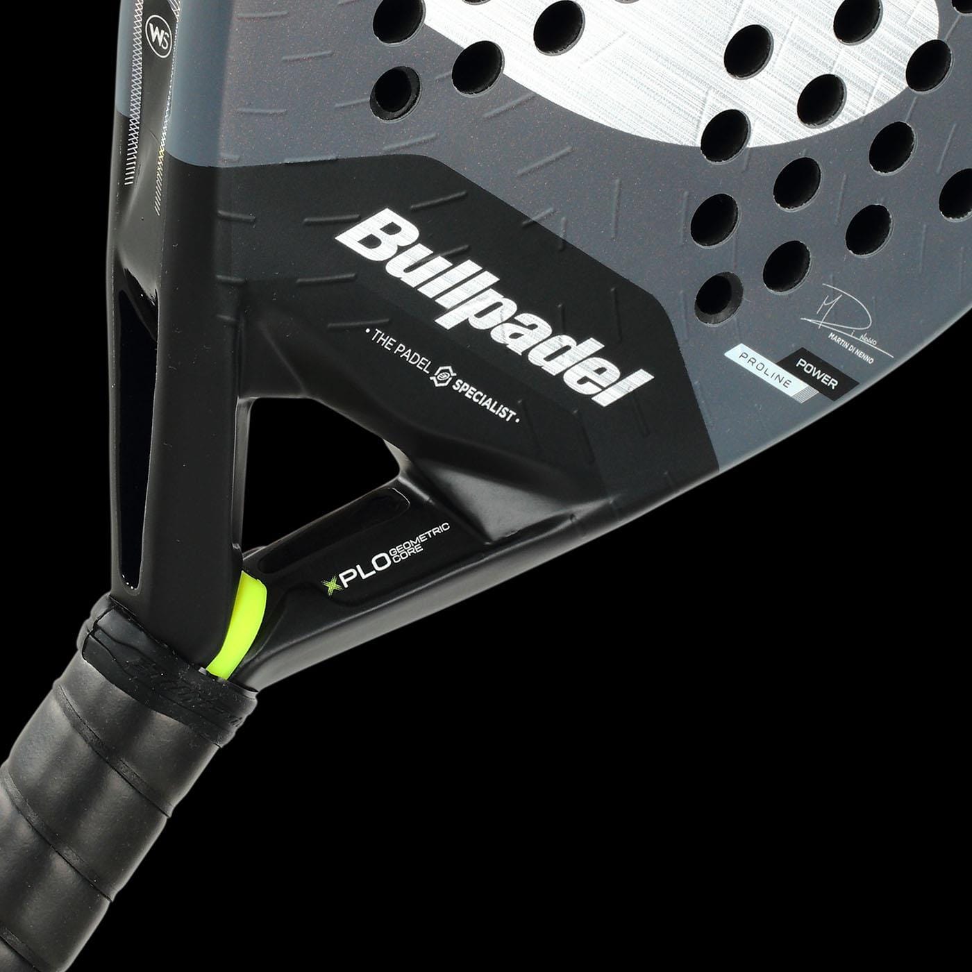 Close-up of the Bullpadel XPLO Comfort 2026 Padel Racket in grey, focusing on the handle and face with visible brand name and technical details. The design ensures outstanding comfort and explosive power, set against a solid black background.