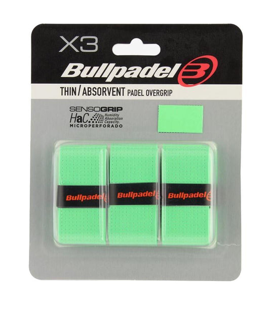 The packaging for the Bullpadel Absorbent Padel Overgrips - Green (3 Pack) showcases three thin, absorbent grips enhanced with "SensoGrip" technology and "microperforado" features, ensuring a Dry Touch experience.