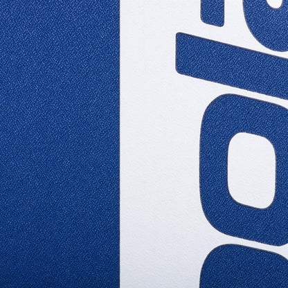 Close-up of the Babolat Court Hero Padel Backpack - Dark Blue by Babolat, showing its textured surface, bold blue vertical stripe, and partial blue text on a white background—emphasizing this padel bag’s stylish design.