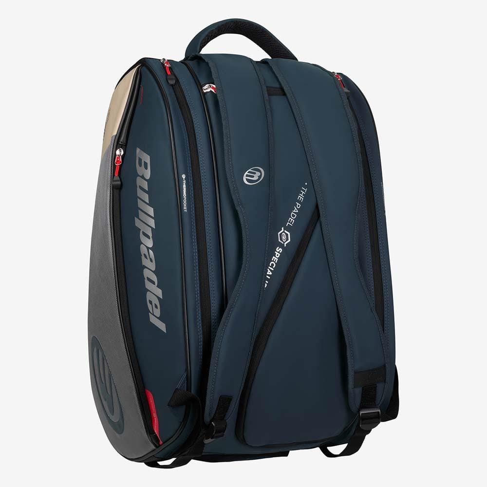 Grey Bullpadel BPP26017 Neuron Padel Bag featuring two main compartments including a thermal racket section, padded straps, black and red zipper accents, and prominent Bullpadel branding displayed against a plain white background.